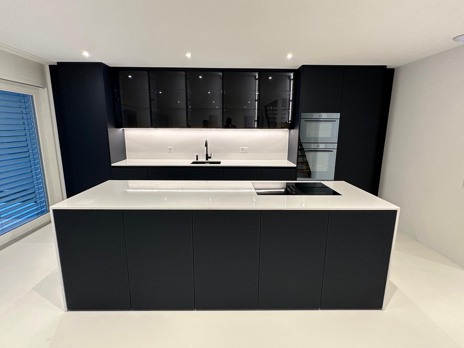 Custom-made black and white kitchen supplied and installed as a product example